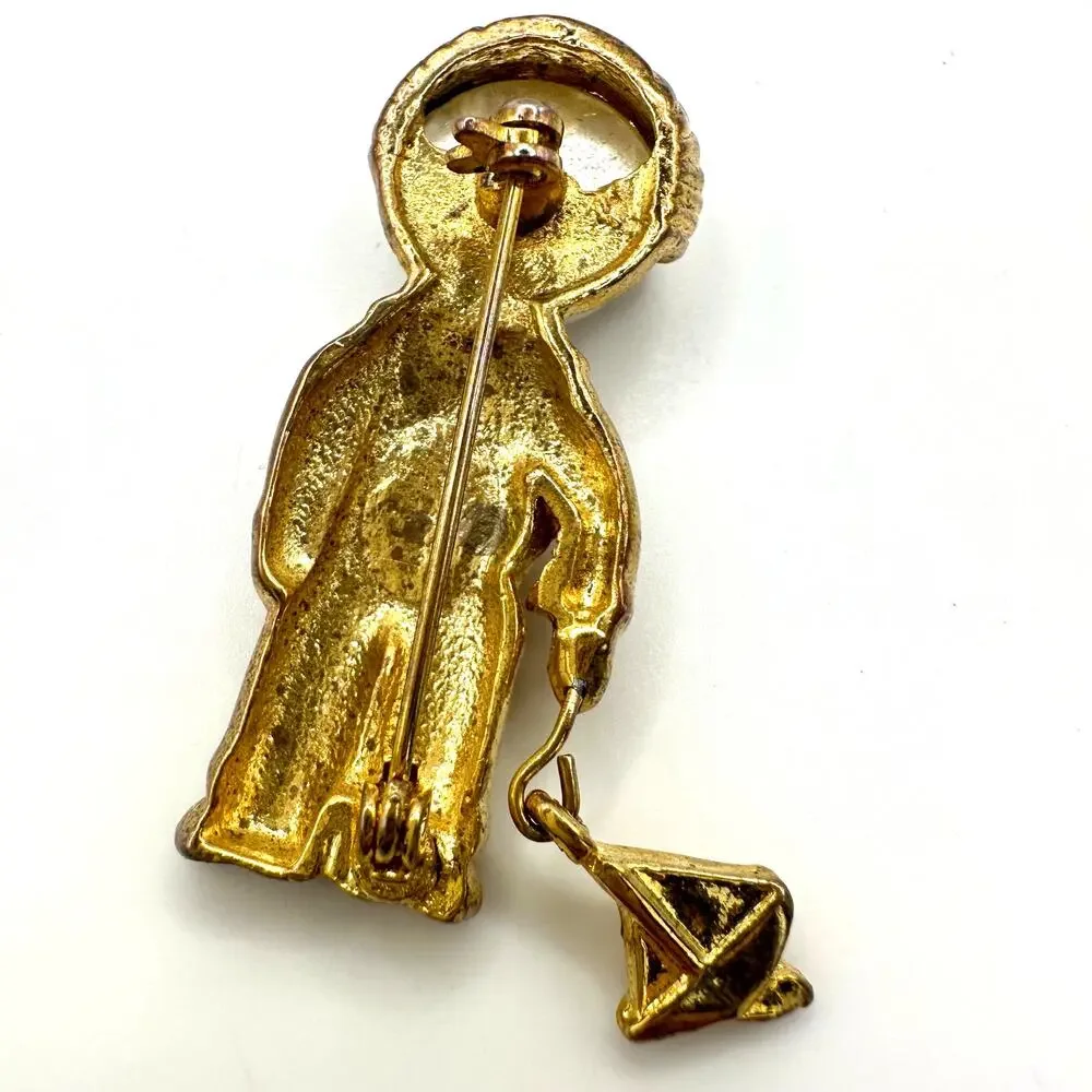 Vintage gold tone boy child with sailboat faux pearl articulated figural brooch